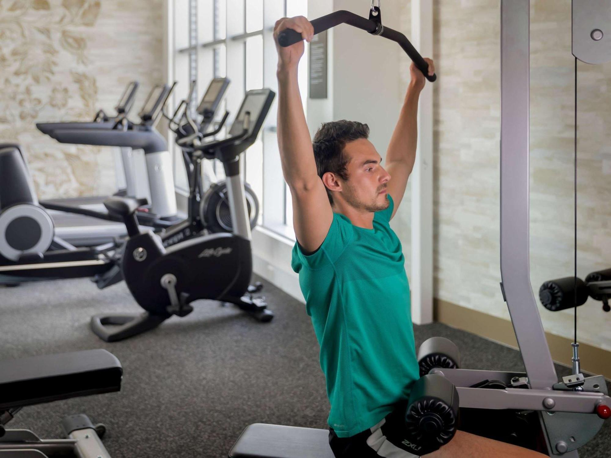 The William Inglis Mgallery Warwick Farm Exterior photo A man performing a lat pulldown